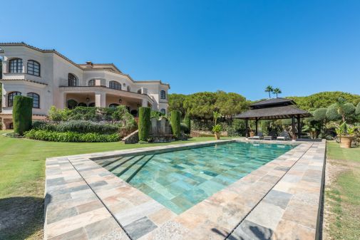 A superb villa built on an elevated site with outstanding panoramic views over golf courses to mountains and the sea.